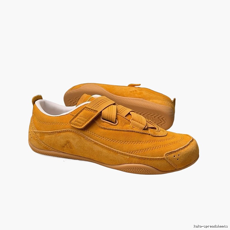 Adidas retro-style yellow sneakers.